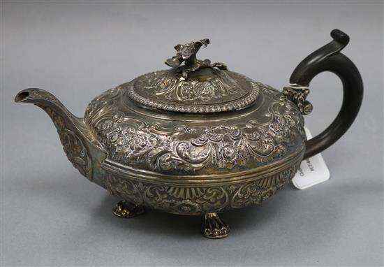 A George III embossed silver teapot, by William Burwash, London 1817